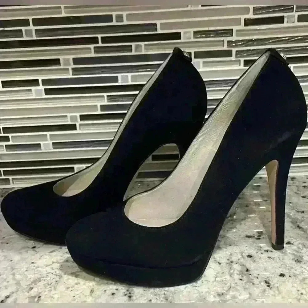 Michael Kors, Black Suede Size 9, pre-owned .75” platform with a 5” heel Sexy!